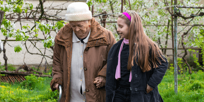 younger child helping a senior