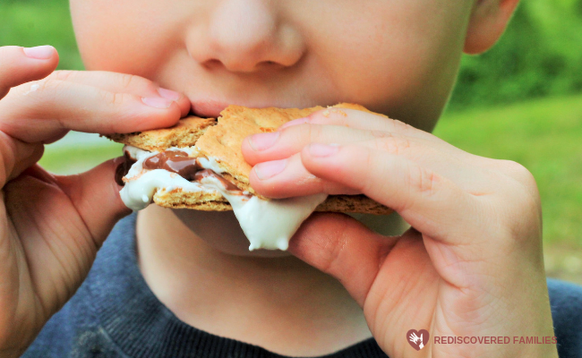 child eating smores
