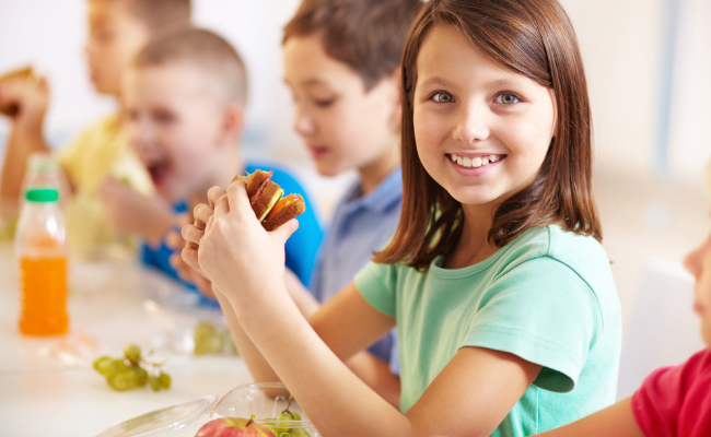 girl eating school lunch
