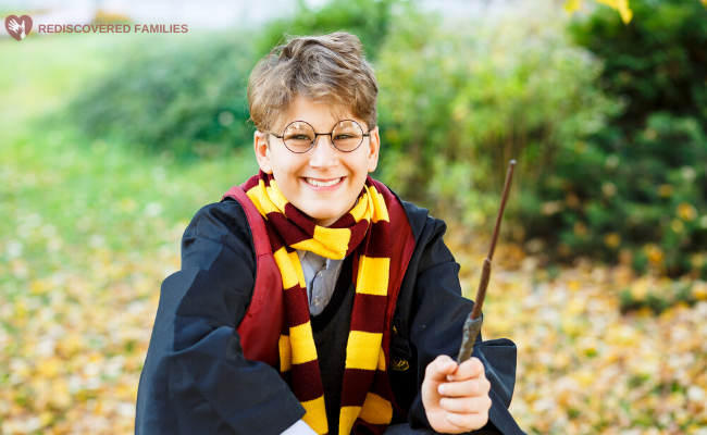 Young boy dressed up in Hogwarts uniform