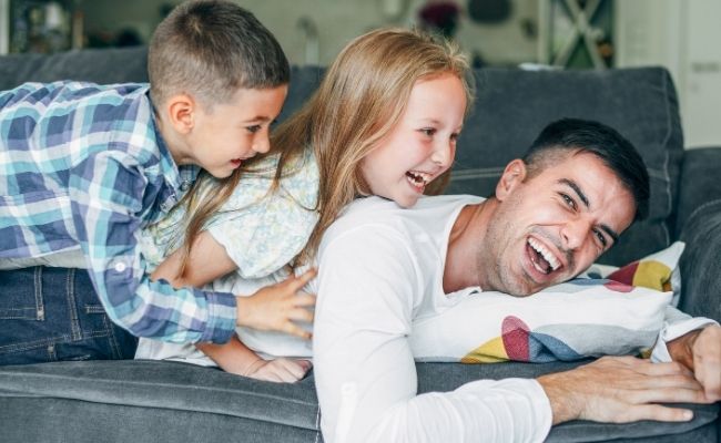 Dad playing with kids