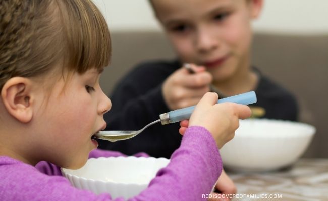 children eating soup