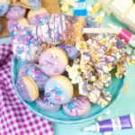 Looking down on a lovely cake dish filled with unicorn snacks