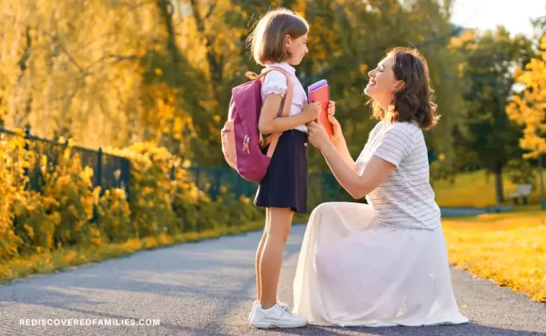 mother talking to her child- who has a school bag on and is holding school books