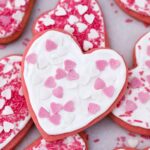 a selection of heart shaped cookies with sprinkles