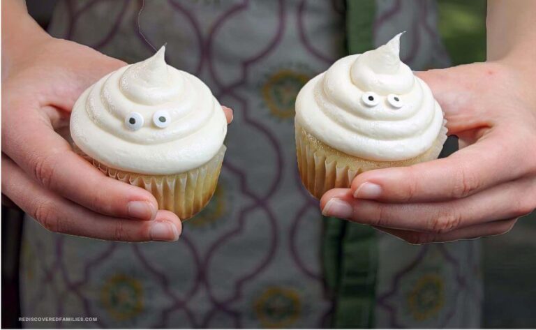 two hands holding ghost cupcakes