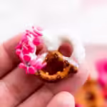 hand holding a finished Valentine pretzels