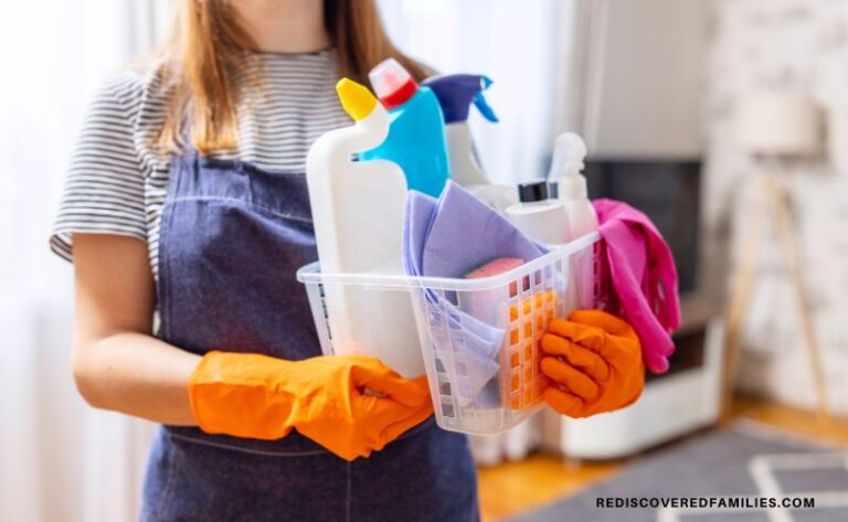 woman wearing rubber gloves and carrying a basket of cleaning products
