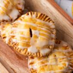 A serving of apple hand pies with glaze, ready to be enjoyed.