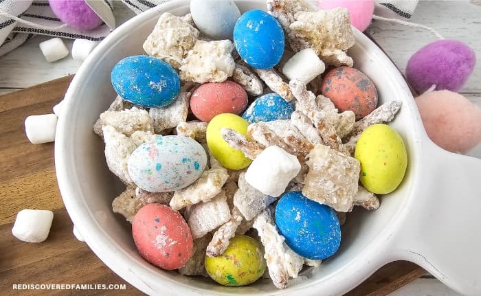 A bowl filled with Bunny Bait Easter snack mix.