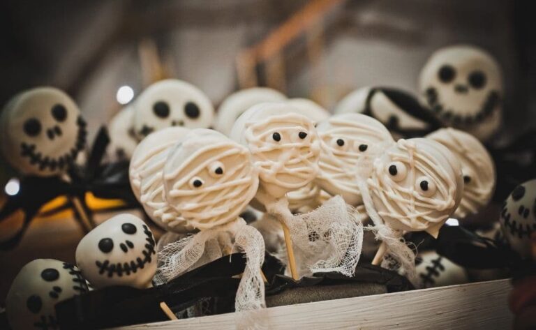 A variety of Halloween cake pops displayed in a box