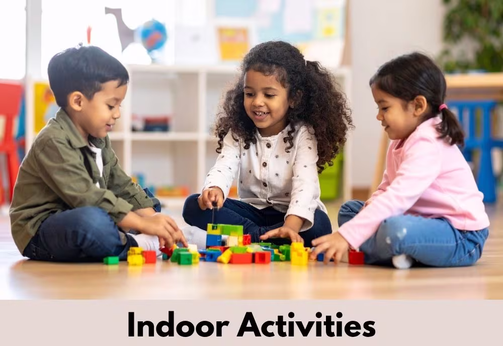 3 children playing with building blocks inside- underneath is the label Indoor Activities