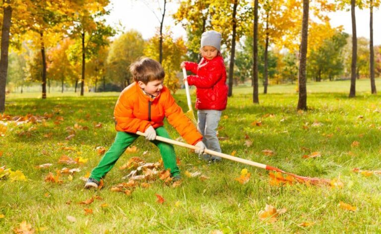 children raking leaves